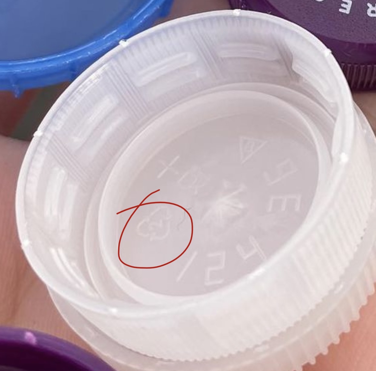 Recycling info circled on bottle top