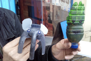 A plastic elephant and a plastic face made from recycled plastic by an artist from local charity Ipsum