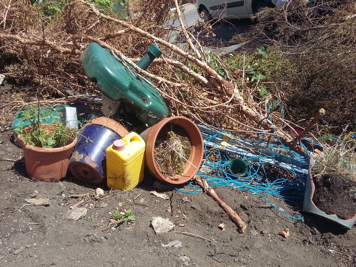 Dumped plant pots and other garden items