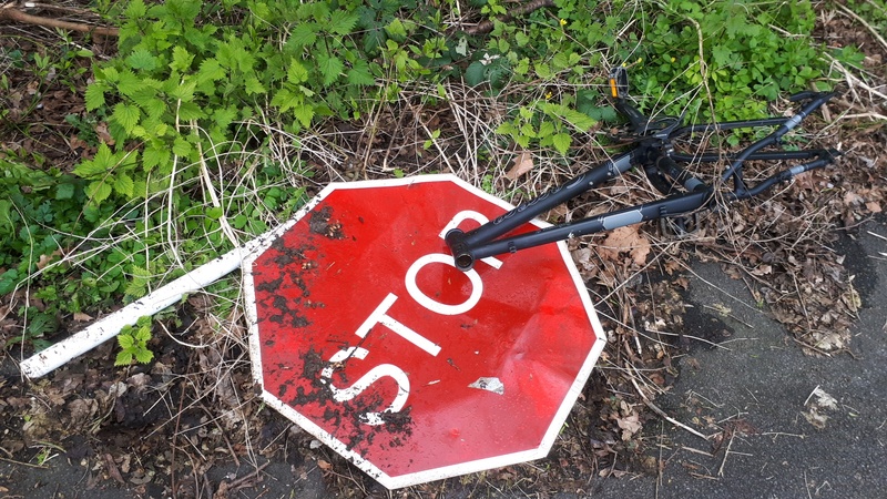 Dumped stop sign and bike frame