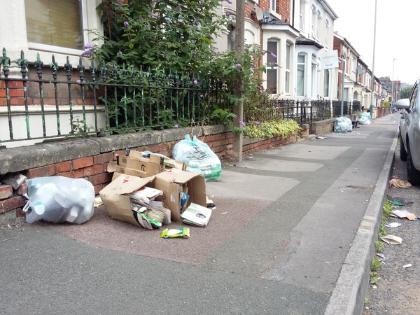 Piles of rubbish left on the pavement close to Cambria Bridge