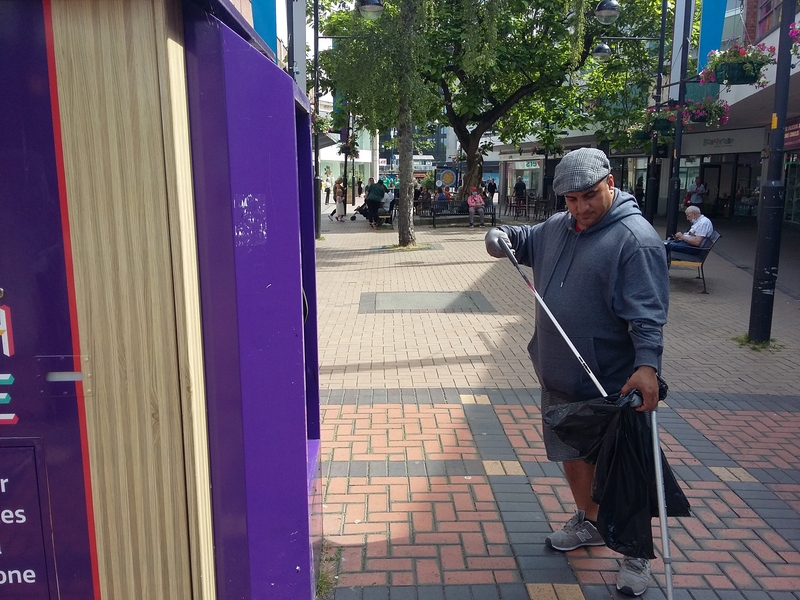 Abdul litter picking in the town centre