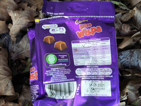 Wispa packaging littered on some leaves
