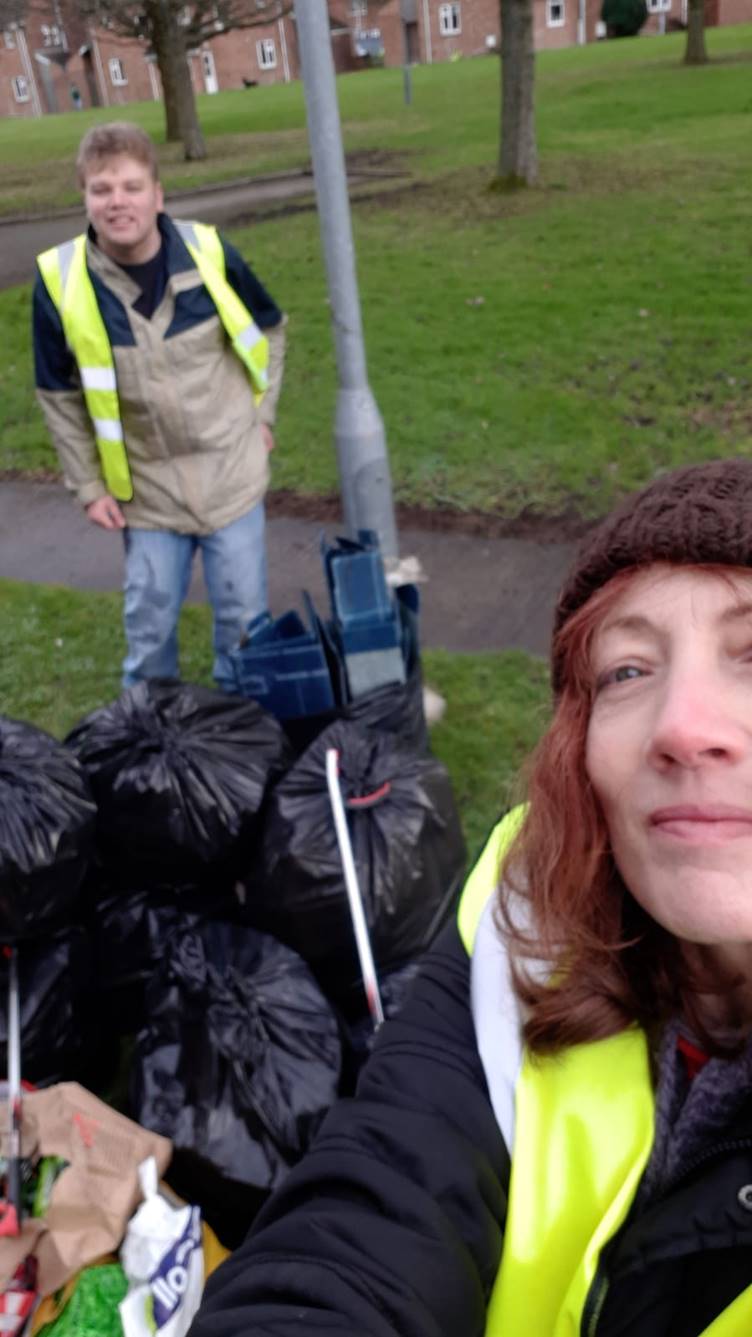 Selfie of a couple of Wroughton parish councillors by collected rubbish