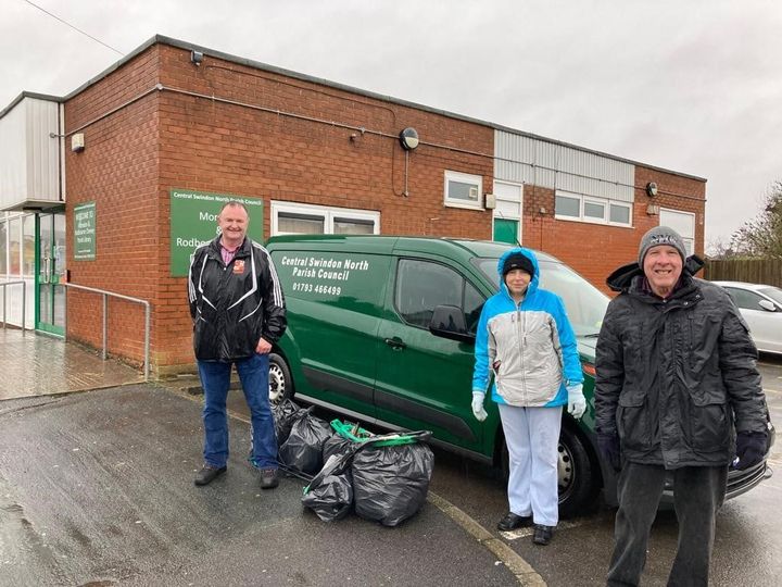 3 litter pickers stand by the parish council van with their haul of rubbish