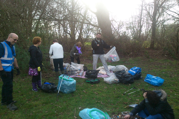 Litter pickers sort through collected rubbish for recycling