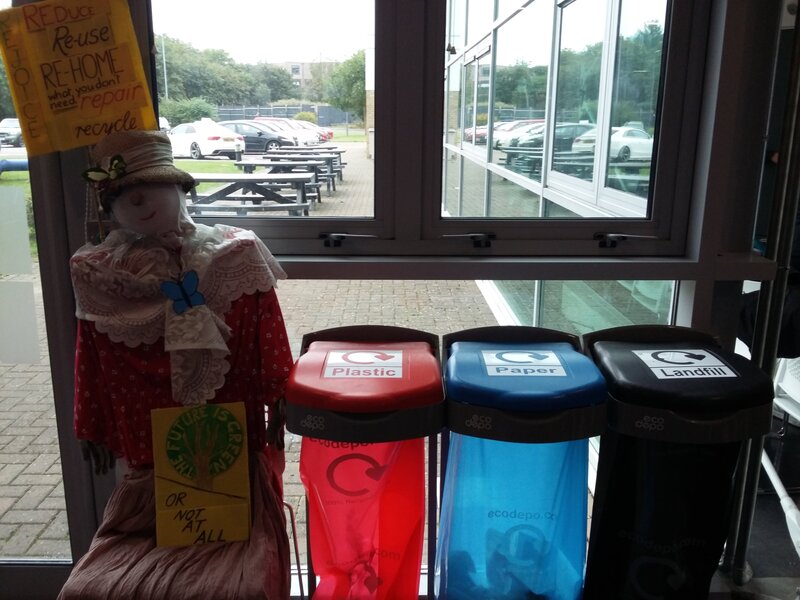 Display model Ethel presides over the recyclng bins - reduce, reuse, recycle