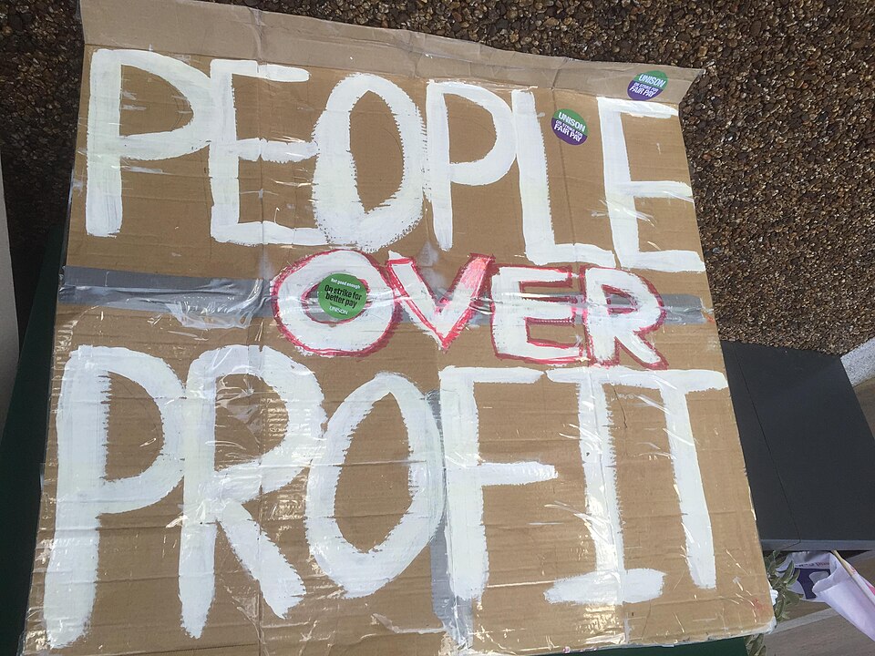 'People over profit' placard