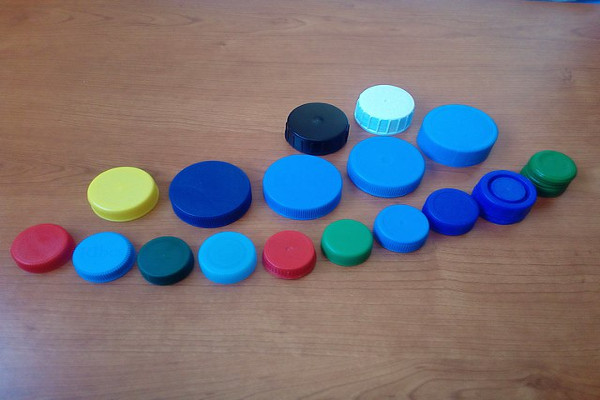 A pile of HDPE bottle tops