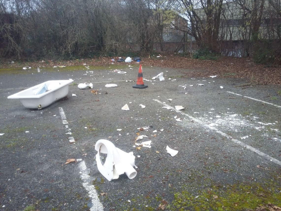 A smashed bathroom suite is strewn across the Oasis car park