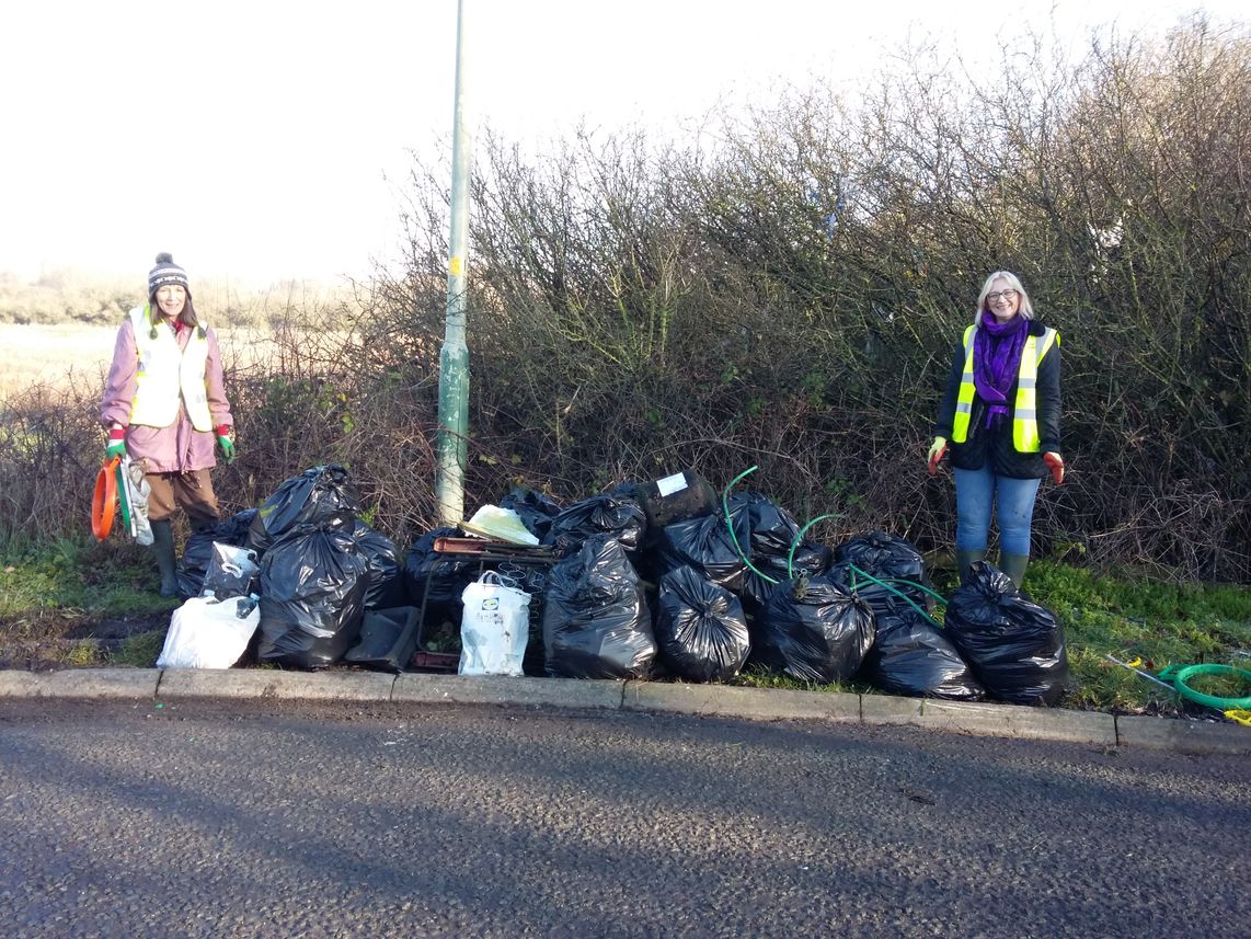 2 litter pickers with a large haul of collected rubbish
