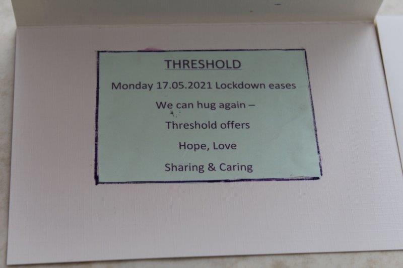 Card which reads, 'Threshold.  Monday 17/05/2021.  We can hug again - Threshold offers Hope, Love, Sharing, and Caring.'