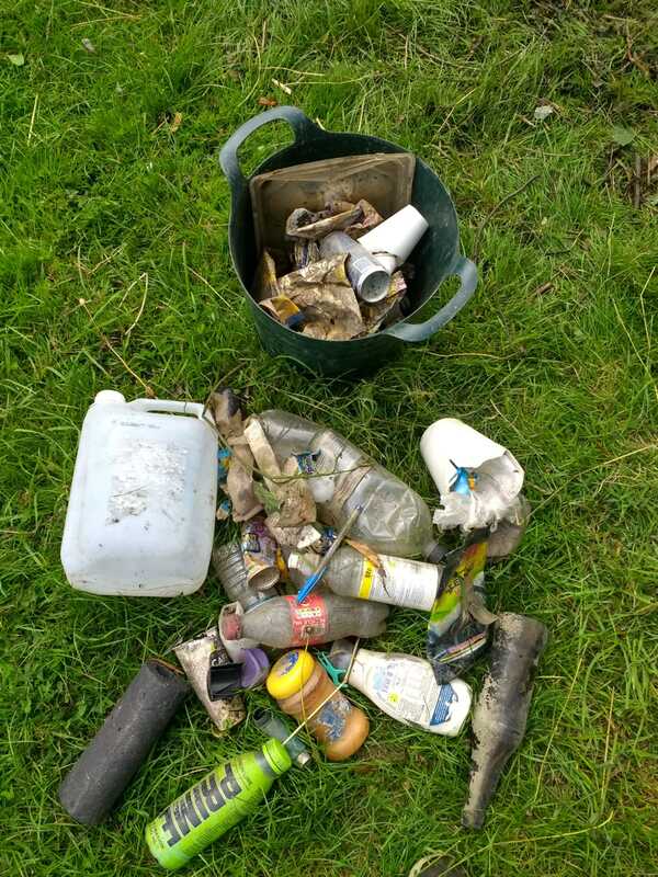 Pile of litter pulled from the river - plastic bottles, 