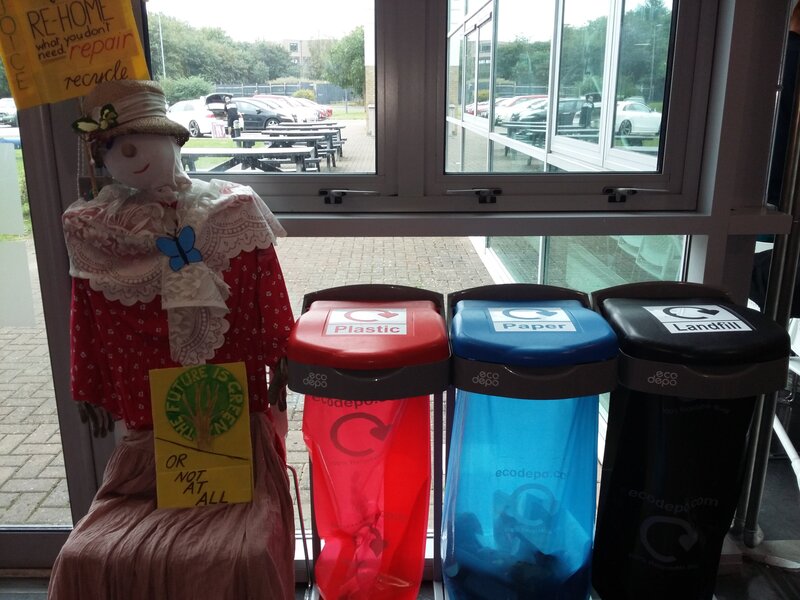 Ethel the Plastic Free Swindon mascot by recycling bins