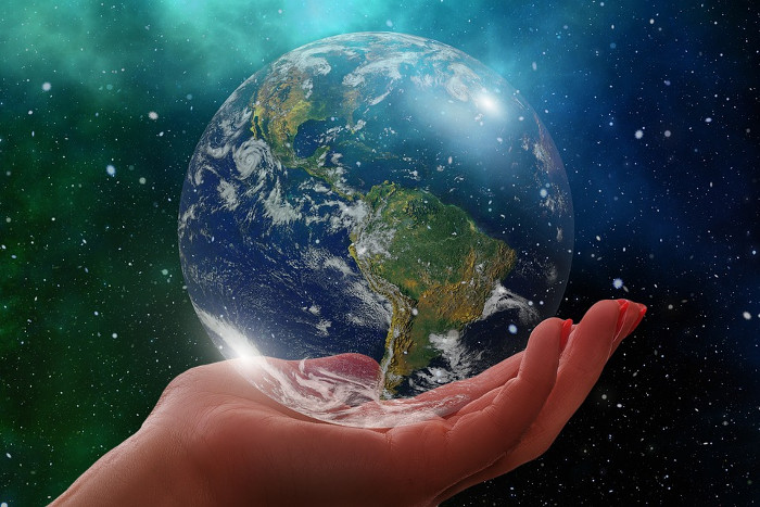 Hand holding Earth globe