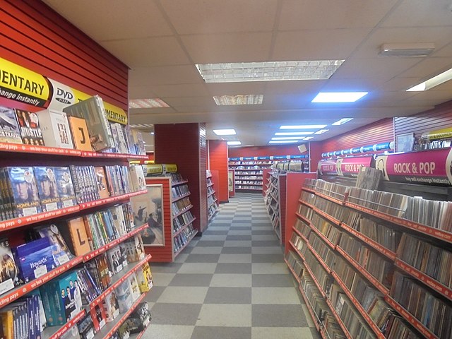 CEX store interior; rows of shelving